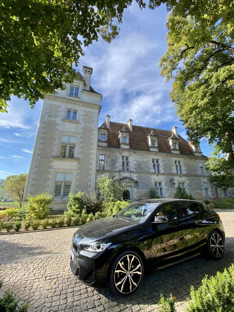 BMW Rental Car in Front of Chateau